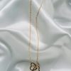 Collier entre 2 coeurs